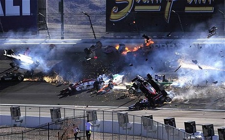    Huge crash at Las Vegas in 2011.  Wheldon is upside down on left side.