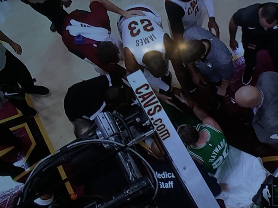 LeBron James shaking Gordon Hayward’s hand as he is taken off the court by a stretcher.
