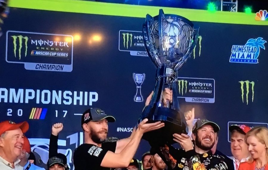 Truex and crew chief Cole Pearn lifting up 68-pound Monster Energy Cup