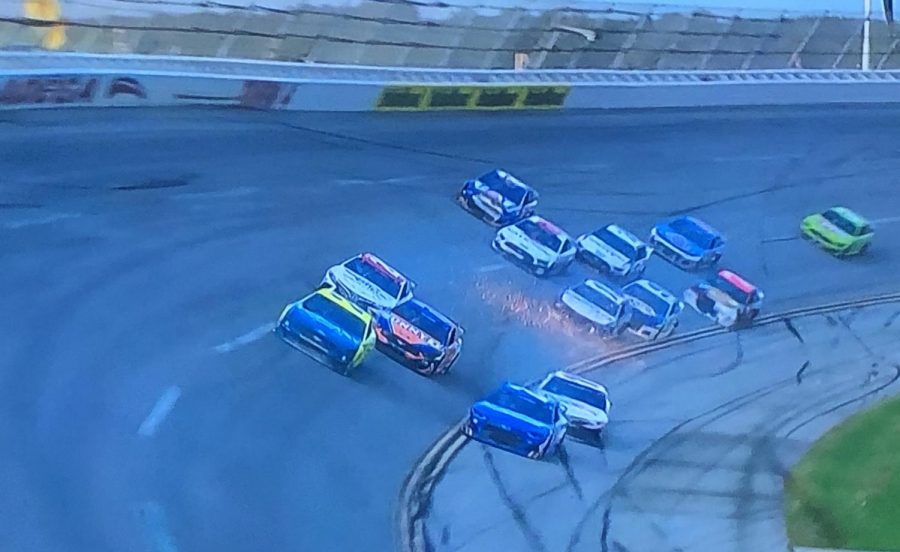 Hamlin(the white FedEx car) dips onto the apron to avoid the 24 of Byron(blue car on the apron)