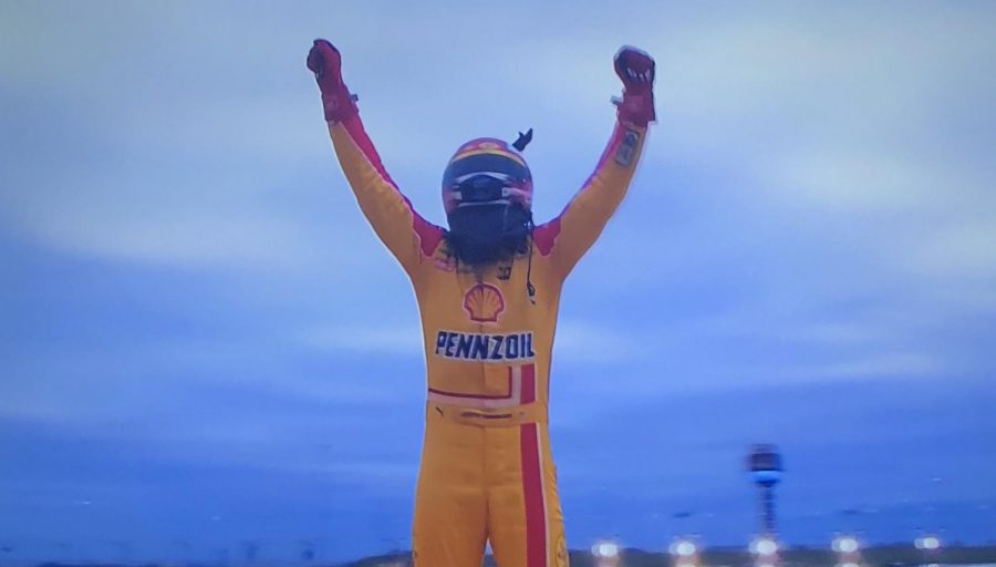 Joey Logano celebrates after winning the Hollywood Casino 400