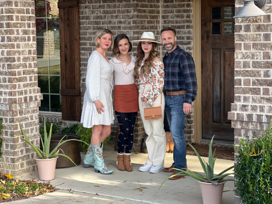 Natalie is second from the right, her sister on her left, and her parents on either side.